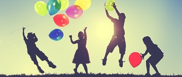 A group of children playing with balloons.