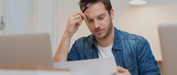 A man reviewing his tax return details