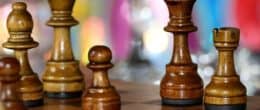 Close up of wooden chess pieces with blurred background