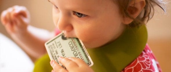 A kid biting a credit card