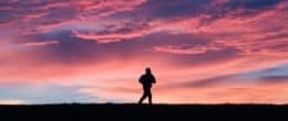 A man running at sunset.