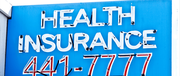 Signage showing text health insurance 441 and 7777