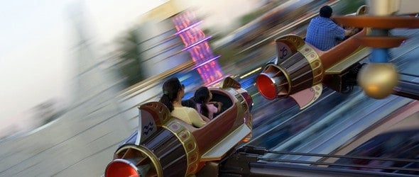 Parents with their kids enjoying fast rides at Funfair