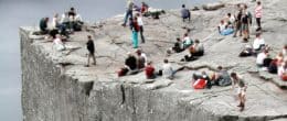Groups of people relaxing and enjoying on a cliff