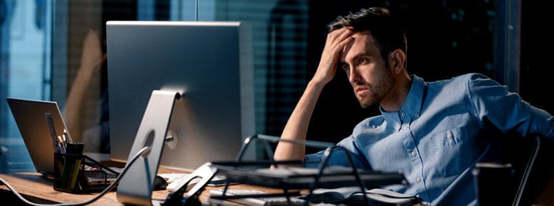 eliminated-tax-deductions-2018 Man reviews the eliminated tax deductions in 2018.