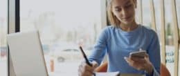 Young woman reviews her tax filing preparation checklist for a gig economy worker.