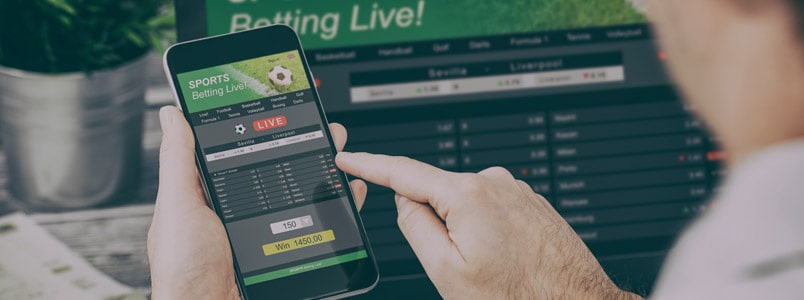Man checking sports betting app on his phone