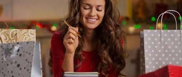 ways-to-save-money-for-the-holidays-Blog Lady reviews her shopping list to make sure she can afford the holidays.